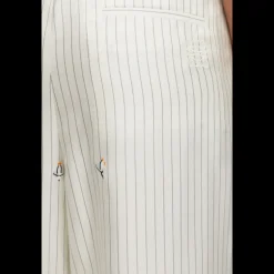 Pantalon pyjama soie écrue rayures broderie pingouin LOEWE x Suna Fujita