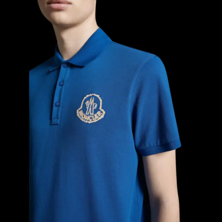 Polo coton piqué MONCLER bleu broderie logo orange