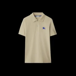 Polo manche courte BURBERRY coton piqué beige broderie chevalier bleu