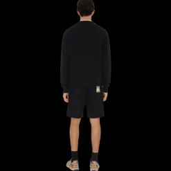 Short ample BURBERRY coton léger noir patch étiquette check beige poche