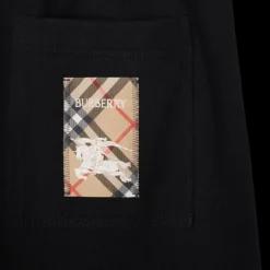 Short ample BURBERRY coton léger noir patch étiquette check beige poche