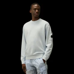 Sweat-shirt CP COMPANY  col rond coton brossé diagonal bleu ciel poche lentille