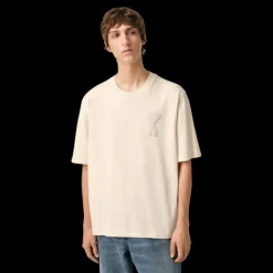 T-shirt AMI Paris col rond jersey de coton bio écru patch gros cœur maille
