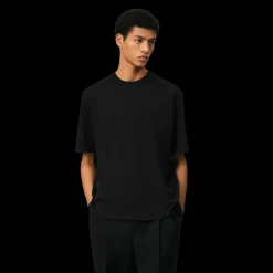 T-shirt AMI Paris col rond jersey de coton bio noir broderie cœur ton sur ton