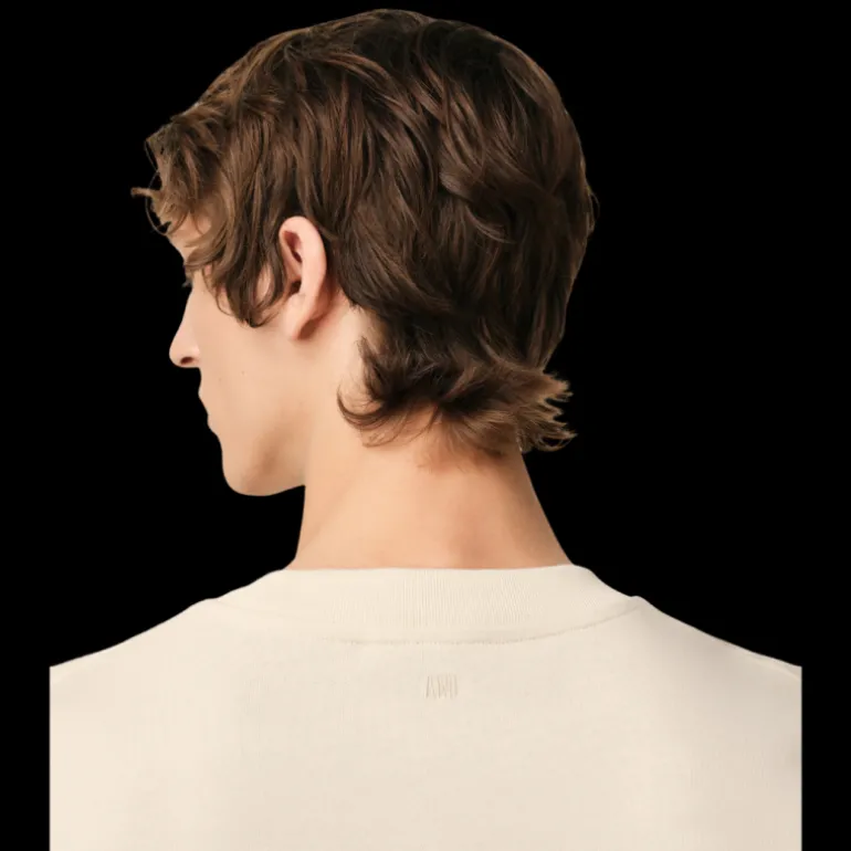 T-shirt AMI Paris col rond jersey de coton bio écru patch gros cœur maille