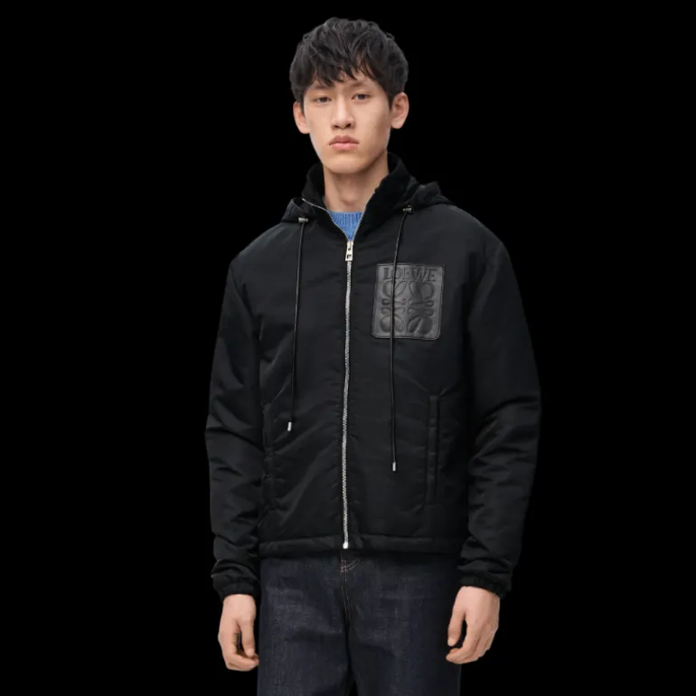 Veste matelassée à capuche LOEWE nylon noir poche cuir anagramme