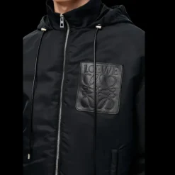 Veste matelassée à capuche LOEWE nylon noir poche cuir anagramme